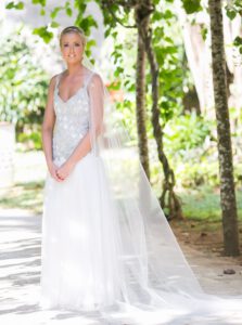 beauiutfully beaded wedding gown with veil by Clasch Design